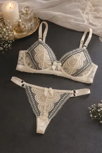 Conjunto de calcinha e sutiã de renda amarela 