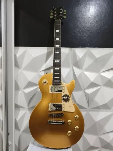 Guitarra elétrica Michael lps strike Gm750n Gold - 2 cordas extras e capa