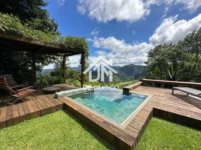 Casa com 5 dormitórios à venda, 516 m² por R$ 5.000.000,00 - Alpes Campos do Jordão - Camp