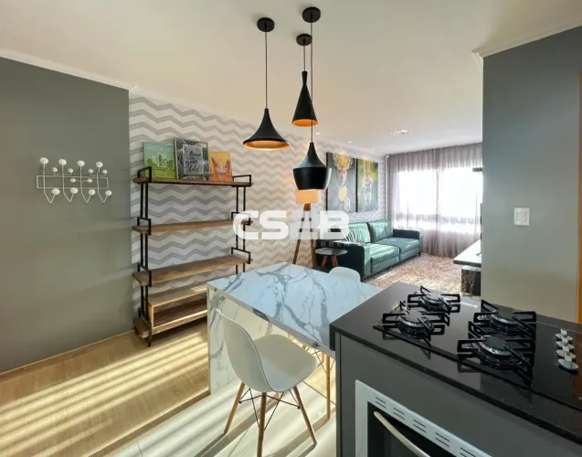 Apartamento mobiliado de 1 dormitório com garagem em condomínio clube no Centro