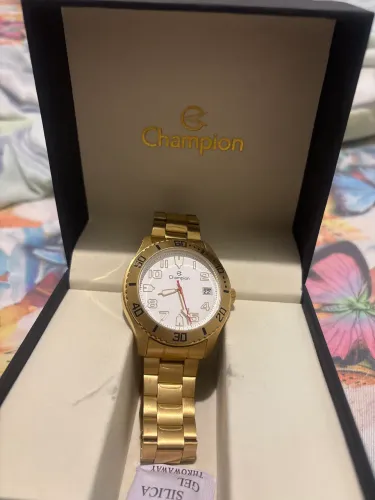Relógio champion dourado