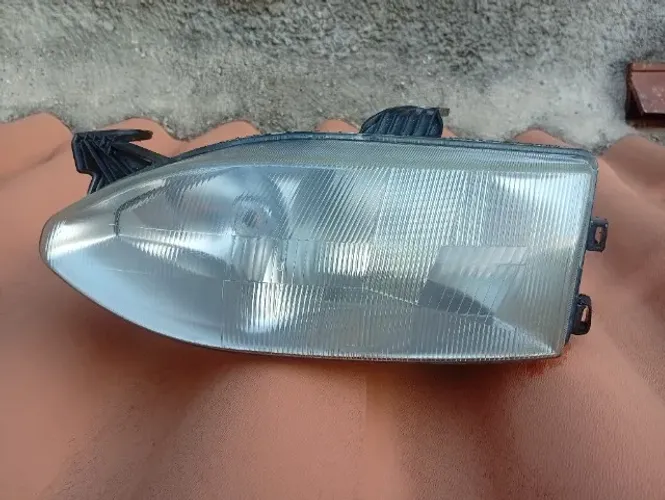 Farol Fiat Palio 96/00