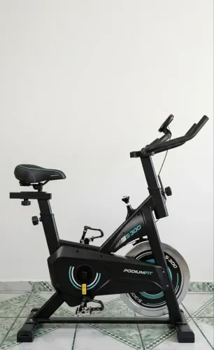 Bicicleta Ergométrica Spinning (Roda 8kg/130kg) + Selim Gel Absolute + Banco Original