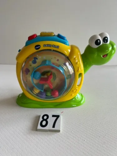 SWIRLY SNAIL VTECH , CANTA, FAZ SONS,E FALA EM INGLES 