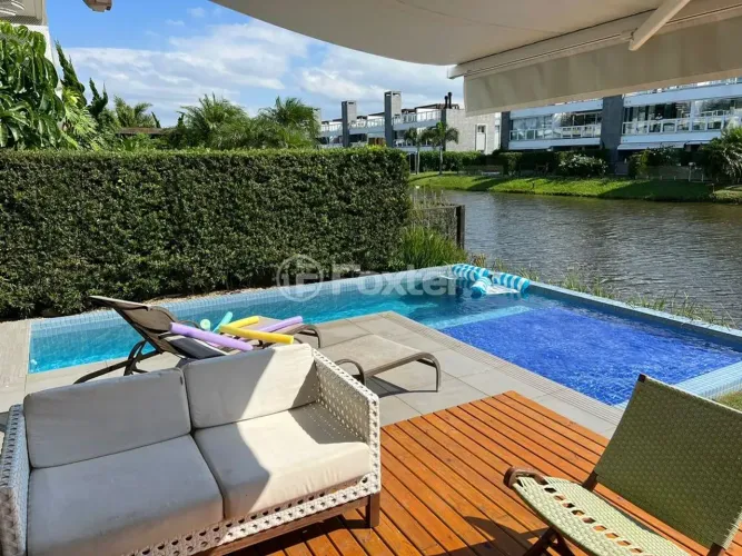 Casa em condomínio fechado com 197 m²e  3 dormitórios em Centro - Xangri-Lá - RS