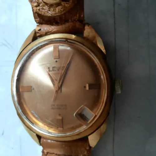 Relogio de pulso. Suíço LEVIS Automatique. Plaque em ouro. 25 rubis. Corda. Antigo. 