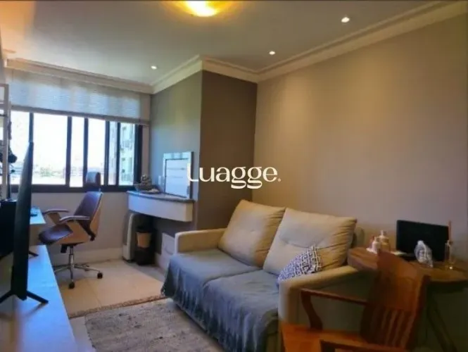 Apartamento com 2 dormitórios, lavabo, banho social e churrasqueira integrada.