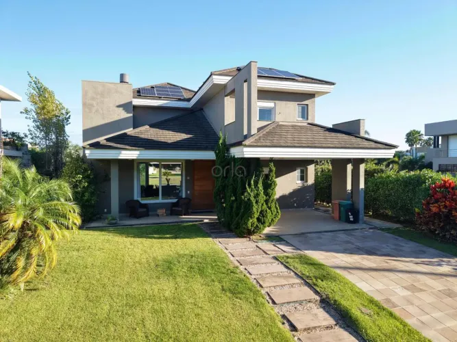 Casa beira lago mobiliada com 04 suítes à venda, 303 m² - Condomínio Villagio de Atlântida