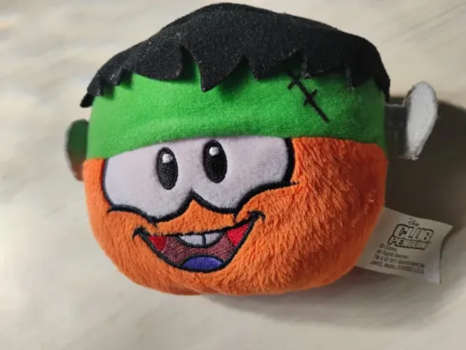 Pelúcia Puffle Laranja Frankenstein Club Penguin