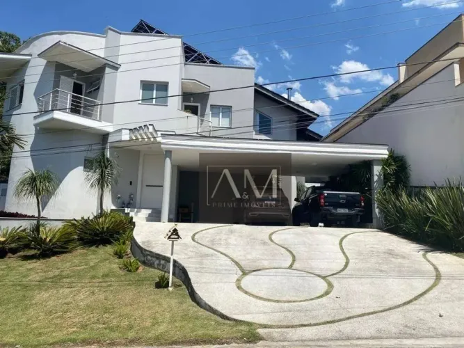 Casa com 4 dormitórios à venda, 420 m² por R$ 3.200.000,00 - Condomínio Aruã - Mogi das Cr