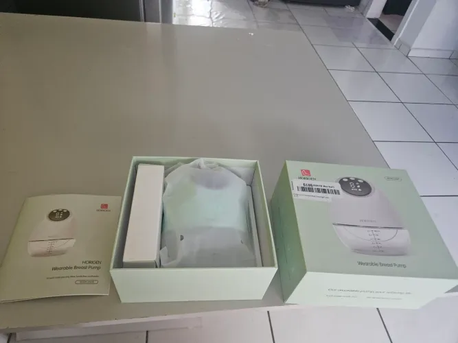 Bomba de tirar leite oculta sem as mãos 