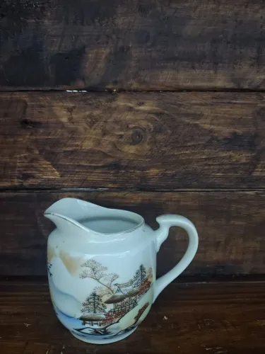 Vendo cremeira porcelana oriental AFI.