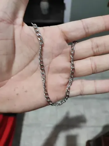 Corrente de aço, acompanha pulseira.