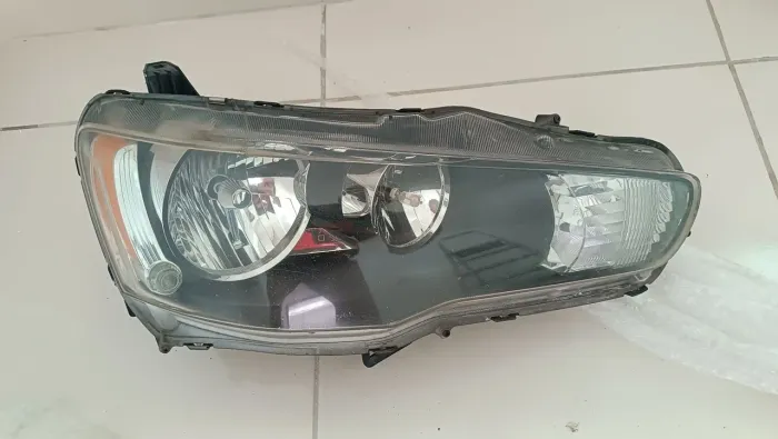 Par de faróis Mitsubishi Lancer originais 
