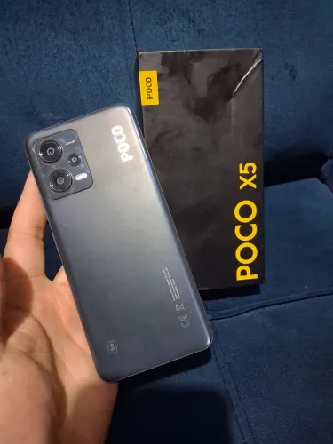 Poco x5 acompanha caixa capinha e carregador