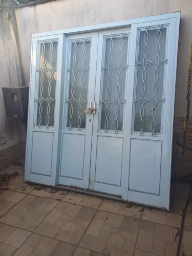 Porta de ferro de correr com vidro