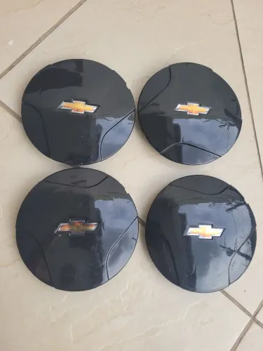 Kit 4 Calotas Corsa wind preta com Emblema  $39,90
