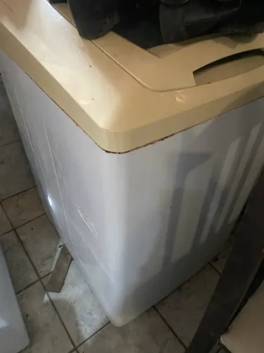 Máquina de lavar com defeito