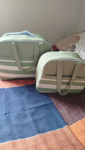 Bolsa maternidade semi-nova tem que ajeitar o zíper da maior