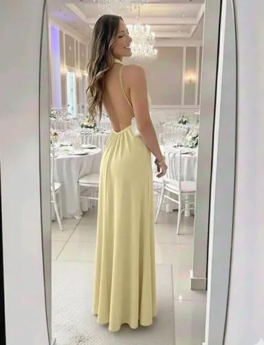 Vende-se vestido nunca usado. Vestido longo amarelo manteiga gola alta Costa nua. R$75,00