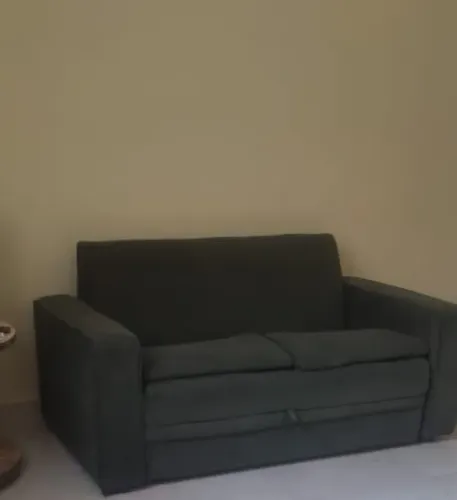 DOAÇÃO sofá cama verde escuro em bom estado. 