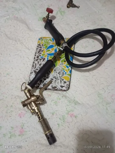 Maçarico relíquia pela porco de metal
