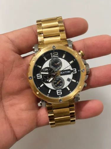 Relógio Masculino Extri Cronógrafo - Dourado e Aço / Mostrador Preto e Branco?