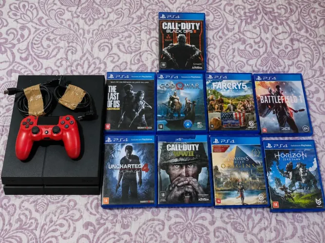 Playstation 4 + 1 controle + 9 jogos em mídia física.