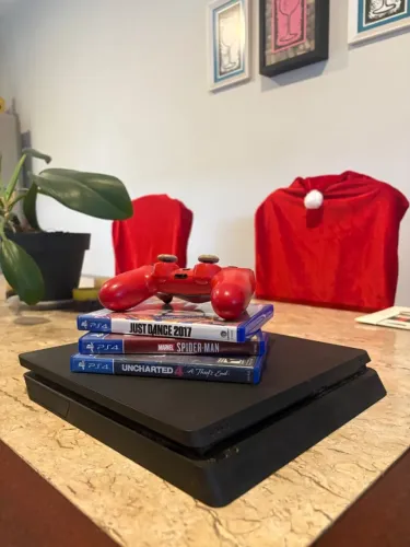 PlayStation 4 com câmera, controle e jogos