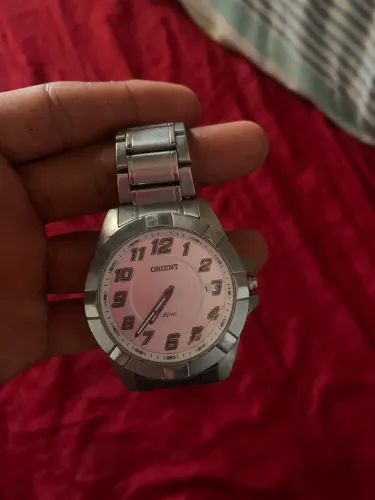 Relógio de prata orient com pequeno defeito