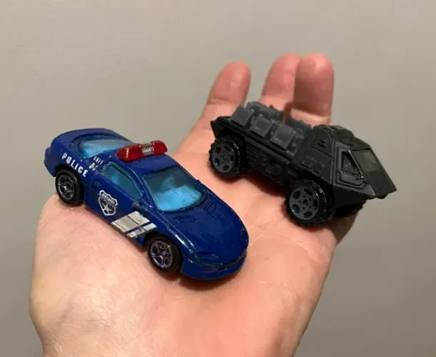 2 carrinhos Matchbox carro Polícia Camaro e Blindado preto