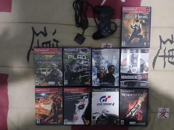 Coleção de jogos originais de ps2 + manete original 