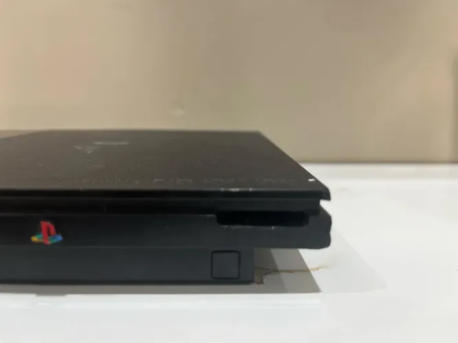 PlayStation 2 slim com defeito