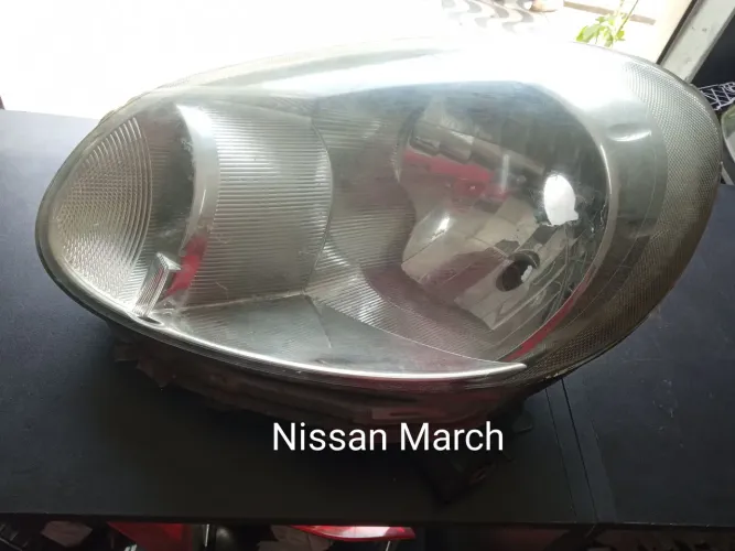 Farol Nissan March original lado esquerdo 