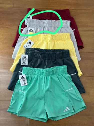 Short duplo com bolso 20,00 cada Nunca usado na etiqueta Vinho e cinza