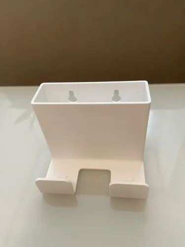 Suporte de parede para celular com espaço para carregamento
