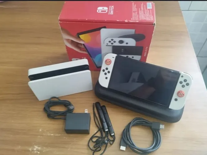 NITENDO SWITCH OLED 128 GB DESBLOQUEADO 2.199.00 pra vender logo ! Com tudo original 