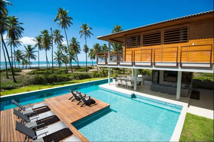 Casa de condomínio para aluguel possui com 4 suites frente mar total