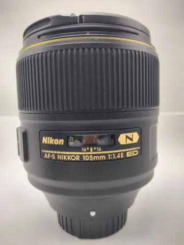 Lente Nikon 105mm 1:1.4 E ED<br>Valor Edson = 8190