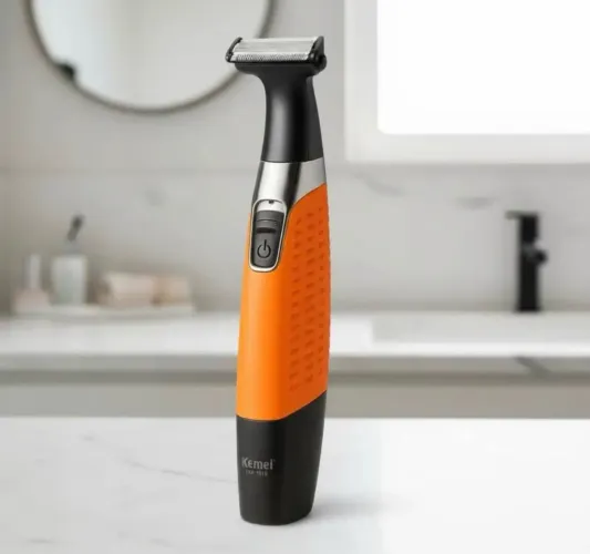 Barbeador Elétrico Kemei 1910 Laranja para Uso Íntimo com 4 Pentes Removíveis