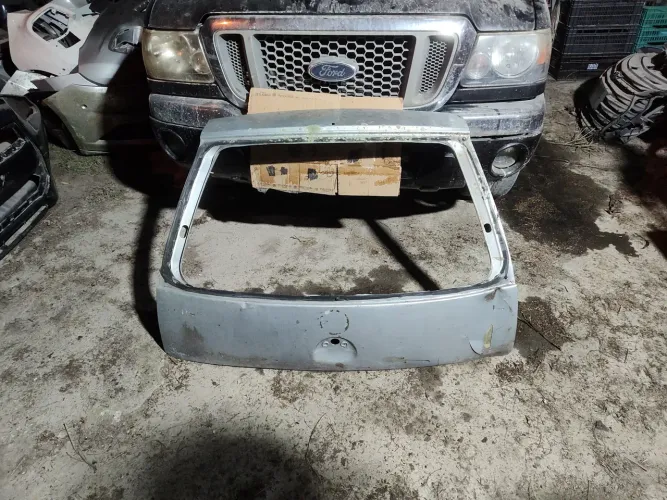 Tampa traseira porta-malas Corsa original GM Chevrolet