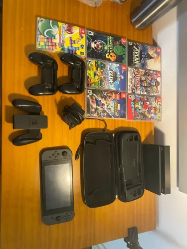 Nintendo switch com caixa, carregador e portas originais em perfeito estado