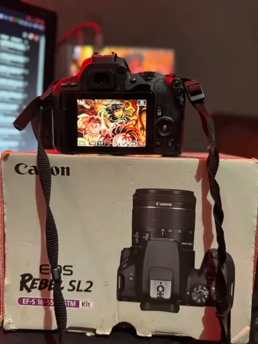 Camera canon SL2 com lente 18-55 1 bateria camera com caixa.