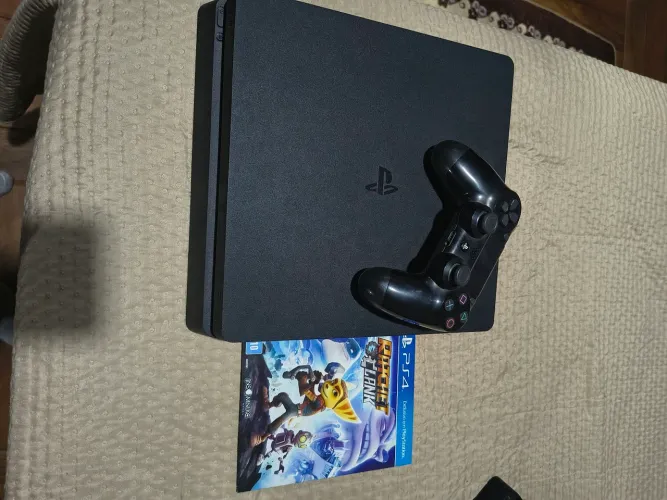Ps4 slim 1 tb com controle original. Aceito troca em Xbox one com volta menos modelo Fat.