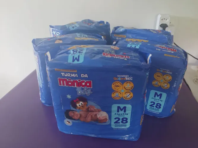 VENDO 5 PACOTES DE FRALDA TAMANHO M MARCA TURMA DA MÔNICA