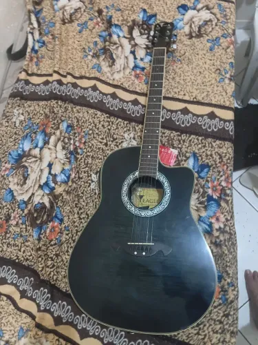 Violão muito bom troco em bike.