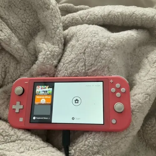 Vendo nintendo switch lite(bloqueado) + jogo