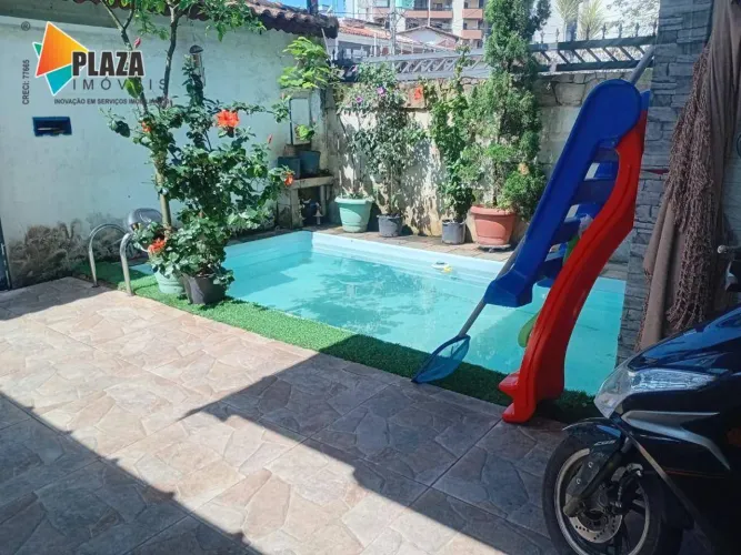 Casa com piscina sendo 3 dormitórios, 2 suítes à venda, 107 m² por R$ 650.000 - Tupi - Pra