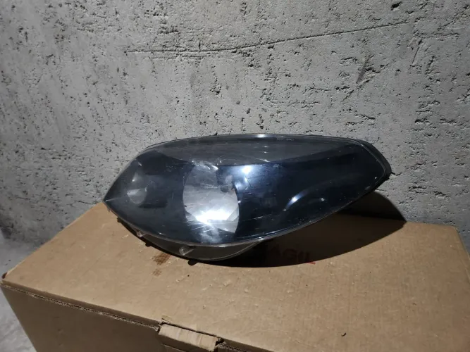 Farol esquerdo máscara Negra Sandero 12/14 original