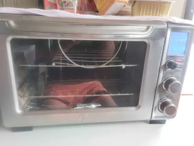 Forno elétrico Oster turbo digital pequeno medindo 48cm x 32 profx 32 alt 110v 10 funcoes